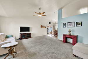 Living room just inside the front door. Vaulted ceilings