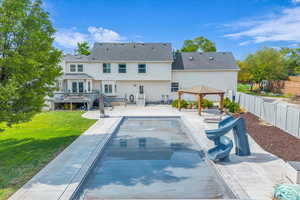Rear view of property featuring Pool and Deck