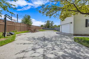 Garage with large parking area for toys or rv