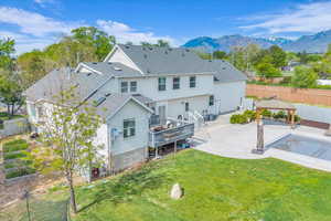 Rear view of property featuring Pool and Deck, garden area