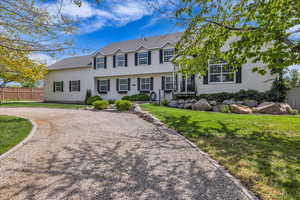 View Front Yard with large half-circle driveway front of house featuring gravel driveway