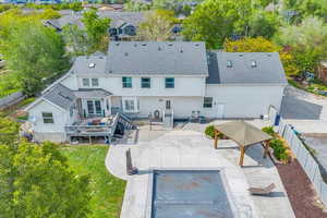 Rear view of property featuring Pool and Deck