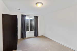 Unfurnished room featuring baseboards and concrete flooring