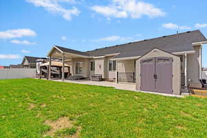 Back of house featuring a gazebo, a patio, stucco siding, an outdoor hangout area, and roof with shingles