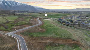 Aerial view of property's location featuring mountains