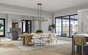 Dining room featuring crown molding, a notable chandelier, light wood finished floors, a large fireplace, and recessed lighting