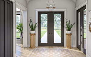 Foyer entrance featuring baseboards and french doors