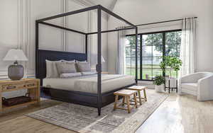 Bedroom with multiple windows and wood finished floors