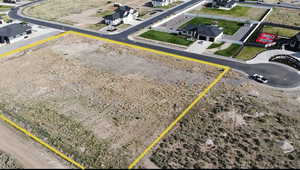 Aerial perspective of suburban area featuring property parcel outlined