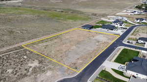 Aerial perspective of suburban area featuring property boundaries highlighted