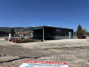 View of outbuilding with a mountain view