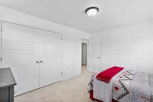 Bedroom with carpet flooring and baseboards
