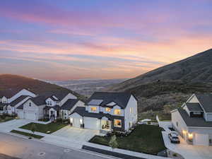 Aerial view at dusk of a residential view and a mountain view
