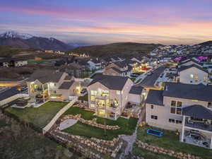 Aerial perspective of suburban area featuring a mountainous background