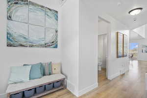 Sitting room featuring wood finished floors and baseboards