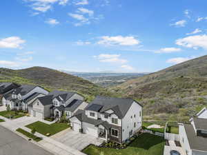 Aerial perspective of suburban area with a mountain backdrop