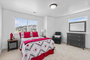 Carpeted bedroom with baseboards