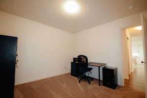 Office featuring carpet floors and baseboards