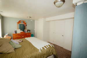 Carpeted bedroom with baseboards