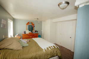 Bedroom featuring carpet flooring and baseboards