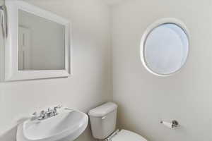 Bathroom featuring toilet and a sink