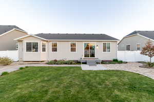 Back of house featuring a patio and stucco siding