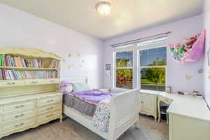 Bedroom with light carpet