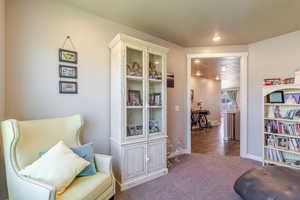 Sitting room with carpet floors, recessed lighting, and baseboards