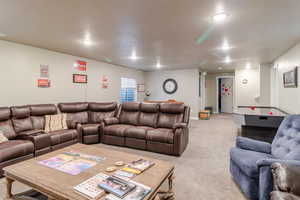 Living area featuring light carpet and recessed lighting