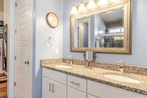 Full bathroom with double vanity