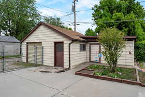 Garage featuring fence