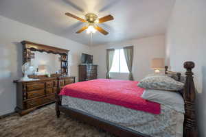 Bedroom featuring carpet floors and a ceiling fan