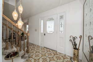 Foyer entrance featuring stairway