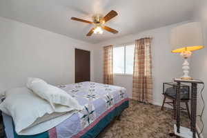 Bedroom featuring carpet and ceiling fan