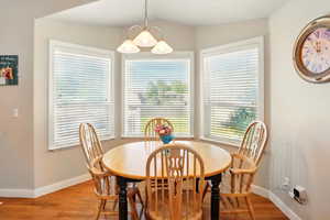 Dining area featuring baseboards and light wood-style flooring