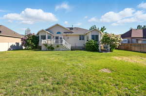 Back of house featuring a deck