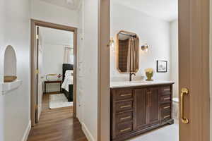Hallway to primary bedroom and bathroom