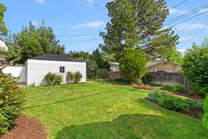 View of back yard with an detached garage