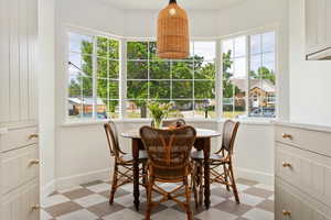 Breakfast nook with tile floors and natural light
