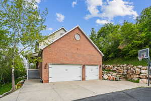 Garage featuring concrete driveway