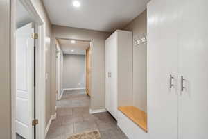 Mudroom with recessed lighting and baseboards