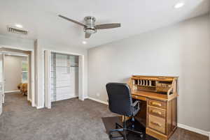 Carpeted office space featuring ceiling fan, recessed lighting, and baseboards