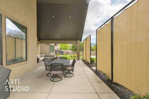 View of patio / terrace with outdoor lounge area, fence, and outdoor dining space