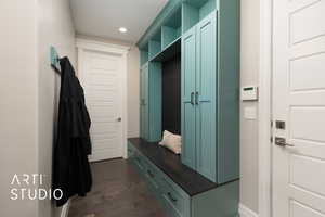 Mudroom featuring dark wood finished floors and recessed lighting