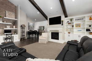 Living area with a glass covered fireplace, baseboards, and wood finished floors