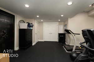 Exercise room featuring recessed lighting and baseboards