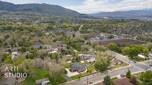 Aerial perspective of suburban area featuring a mountainous background