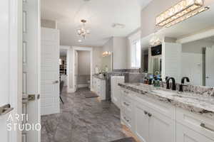 Full bathroom with a chandelier, marble finish floors, vanity, recessed lighting, and baseboards