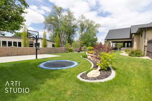 View of yard with a trampoline