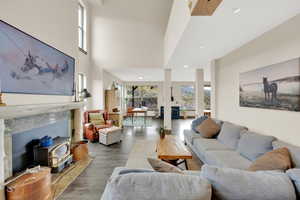 Living area featuring wood finished floors and recessed lighting